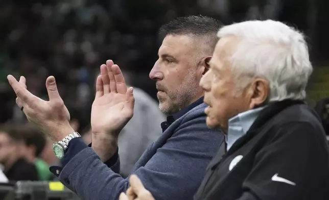 New England Patriots head coach Mike Vrabel, left, applauds while seated with team owner Robert Kraft during the first half in game 2 of a first-round NBA playoff basketball series between the Boston Celtics and Orlando Magic, Wednesday, April 23, 2025, in Boston. (AP Photo/Charles Krupa)