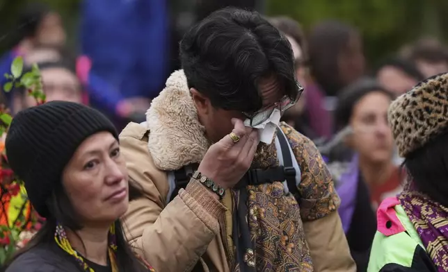 Ben Castro wipes tears from his eyes during a vigil at Sir Alexander Mackenzie Elementary School after a vehicle drove into a crowd during a Filipino heritage festival in Vancouver, British Columbia, Monday, April 28, 2025. (AP Photo/Lindsey Wasson)