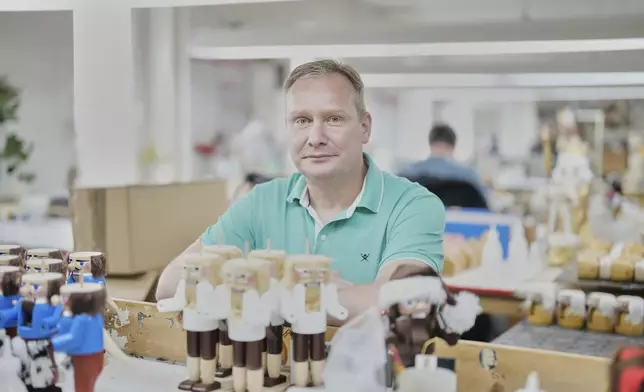 Rico Paul, manager and owner of the Steinbach-Volkskunst nutcracker factory, poses for a photograph inside his factory, in Marienberg, Germany, Tuesday, April 15, 2025. (AP Photo/Markus Schreiber)