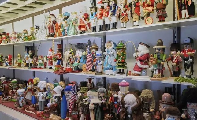 Nutcrackers are displayed at the Steinbach-Volkskunst nutcracker factory in Marienberg, Germany, Tuesday, April 15, 2025. (AP Photo/Markus Schreiber)