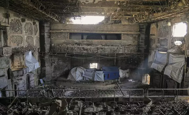 Tents for displaced Palestinians are set up in the auditorium of the Islamic University, damaged by an Israeli bombardment, in Gaza City, Saturday, April 5, 2025. (AP Photo/Jehad Alshrafi)