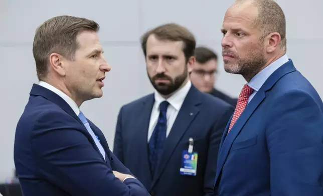 Belgium's Defense Minister Theo Francken, right, talks with Estonia's Defense Minister Hanno Pevkur, right, during a coalition of the willing defence ministers meeting at NATO headquarters in Brussels, Belgium, Thursday, April 10, 2025. (AP Photo/Geert Vanden Wijngaert)