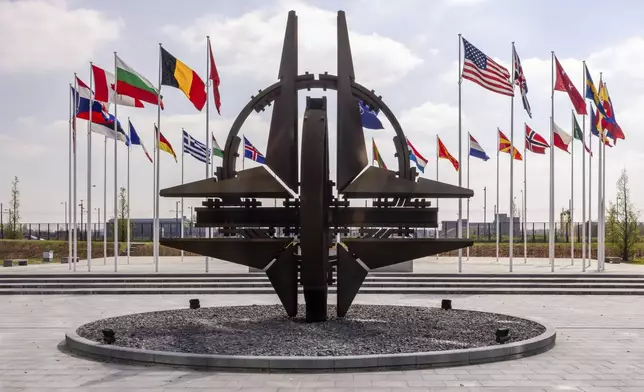 Flags of the Alliance members flap in the wind prior to a coalition of the willing defence ministers meeting at NATO headquarters in Brussels, Belgium, Thursday, April 10, 2025. (AP Photo/Geert Vanden Wijngaert)