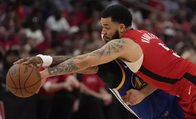 Houston Rockets guard Fred VanVleet (5) and Golden State Warriors guard Gary Payton II (0) reach for a loose ball during the first half of Game 1 of an NBA basketball first-round playoff series in Houston, Sunday, April 20, 2025. (AP Photo/Ashley Landis)