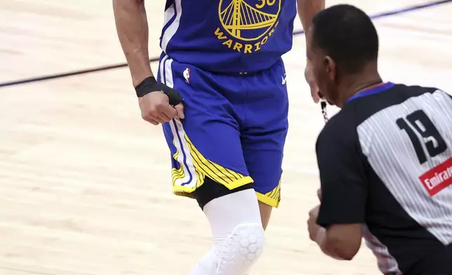 Golden State Warriors' Stephen Curry reacts a 3-pointer against the Houston Rockets during the second half of Game 1 of an NBA basketball first-round playoff series in Houston, Sunday, April 20, 2025. (Scott Strazzante/San Francisco Chronicle via AP)
