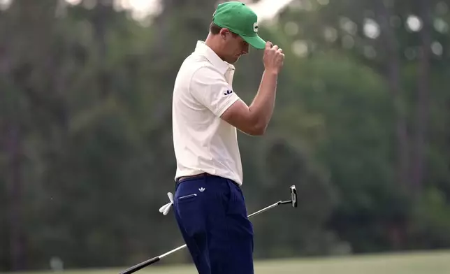 Ludvig Aberg, of Sweden, waves after making a putt on the 14th hole during the third round at the Masters golf tournament, Saturday, April 12, 2025, in Augusta, Ga. (AP Photo/Julia Demaree Nikhinson)