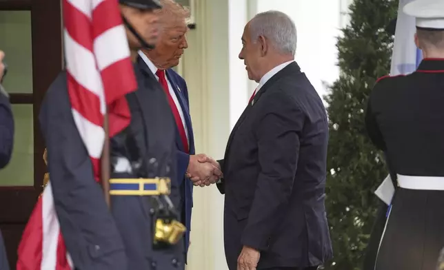 President Donald Trump, left, greets Israel's Prime Minister Benjamin Netanyahu at the White House, Monday, April 7, 2025, in Washington. (AP Photo/Evan Vucci)