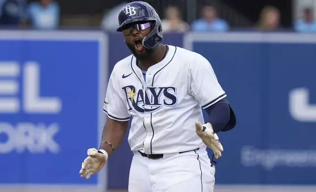 Tampa Bay Rays' Junior Caminero celebrates his double off Los Angeles Angels pitcher José Soriano during the fourth inning of a baseball game Thursday, April 10, 2025, in Tampa, Fla. (AP Photo/Chris O'Meara)