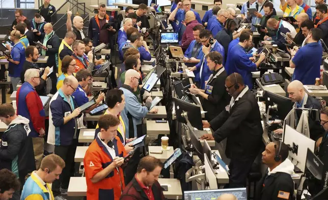 Traders work on the options trading floor at the Cboe Global Markets in Chicago, Tuesday, April 8, 2025. (AP Photo/Nam Y. Huh)