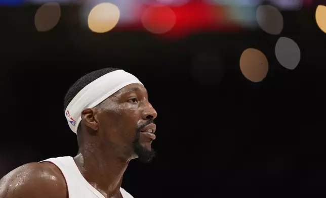 Miami Heat center Bam Adebayo (13) looks on in the first half of an NBA play-in tournament basketball game against the Atlanta Hawks, Friday, April 18, 2025, in Atlanta. (AP Photo/Brynn Anderson)