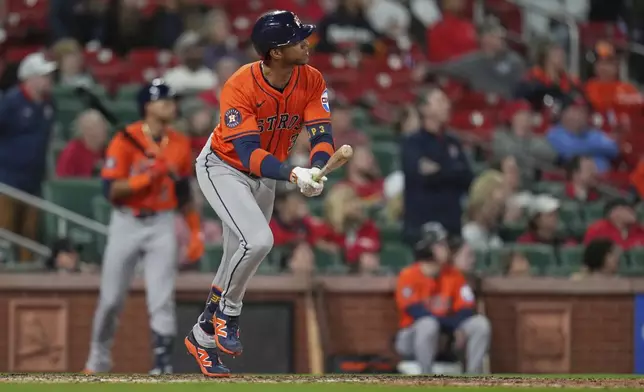 Houston Astros' Jeremy Pena watches his three-run home run during the ninth inning of a baseball game against the St. Louis Cardinals Monday, April 14, 2025, in St. Louis. (AP Photo/Jeff Roberson)