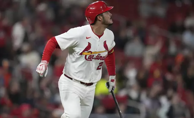 St. Louis Cardinals' Nolan Arenado watches his solo home run during the seventh inning of a baseball game against the Houston Astros Monday, April 14, 2025, in St. Louis. (AP Photo/Jeff Roberson)
