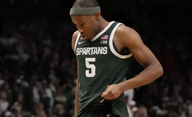 Michigan State guard Tre Holloman walks off the court after the second half in the Elite Eight of the NCAA college basketball tournament against Auburn, Sunday, March 30, 2025, in Atlanta. (AP Photo/Brynn Anderson)
