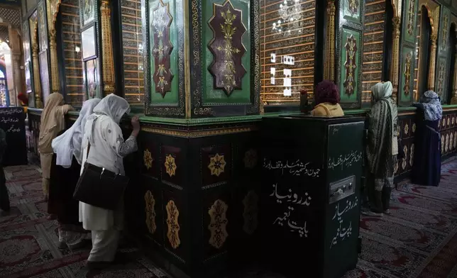 Kashmiri Muslims pray inside the shrine of Sheikh Abdul Qadir Jeelani, commonly known as Dastageer Sahib, in Srinagar, Indian controlled Kashmir, Wednesday, April 2, 2025. (AP Photo/Mukhtar Khan)