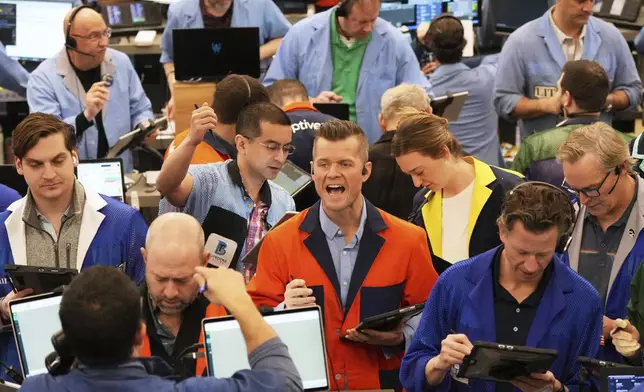 Traders work on the options trading floor at the Cboe Global Markets in Chicago, Tuesday, April 8, 2025. (AP Photo/Nam Y. Huh)