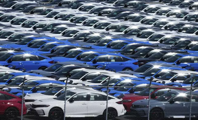 Export vehicles are parked at Daikoku Pier in Yokohama, near Tokyo, Tuesday, April 8, 2025. (AP Photo/Hiro Komae)