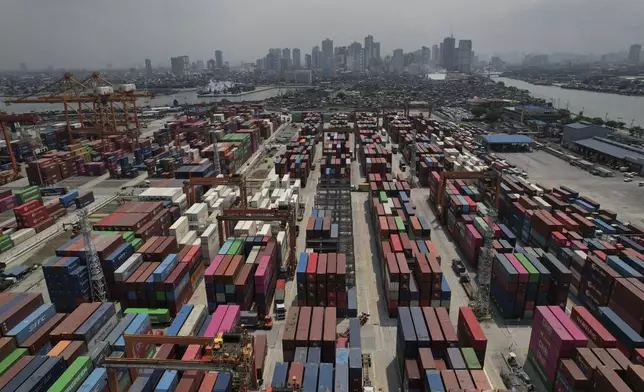 Stacks of containers at the Manila International Container Terminal at the Philippine capital on Tuesday, April 8, 2025. (AP Photo/Aaron Favila)