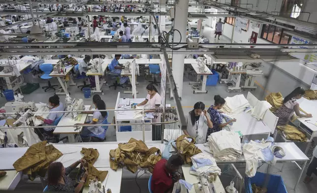 Workers are seen in an apparel factory at the Katunayake export processing zone in Colombo, Sri Lanka, Wednesday, April 9, 2025. (AP Photo/Eranga Jayawardena)