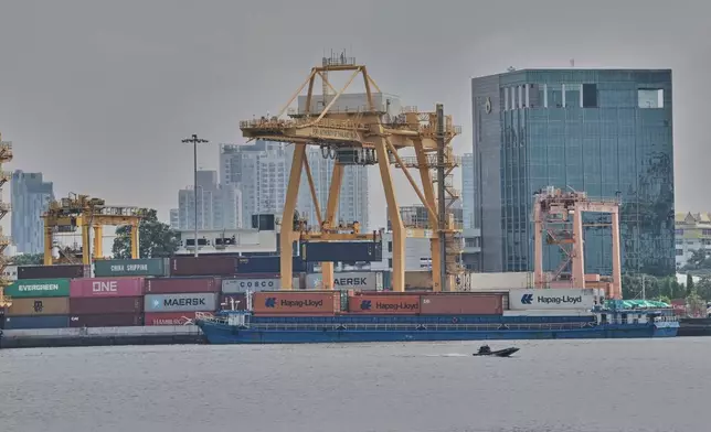 Cranes work on stacks of containers at Bangkok Port in Bangkok, Thailand, Wednesday, April 9, 2025. (AP Photo/Sakchai Lalit)