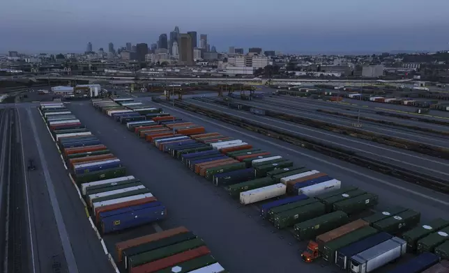 Shipping containers are seen near downtown Los Angeles, Tuesday, April 8, 2025. (AP Photo/Jae C. Hong)