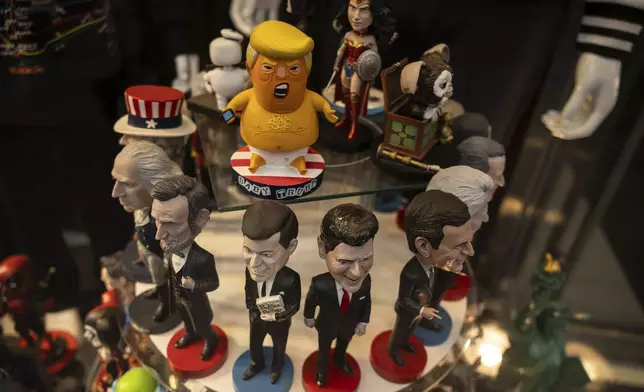 Figurines depicting former presidents of the United States are displayed for sale at a souvenir store in Times Square, in New York, Tuesday, April 8, 2025. (AP Photo/Yuki Iwamura)