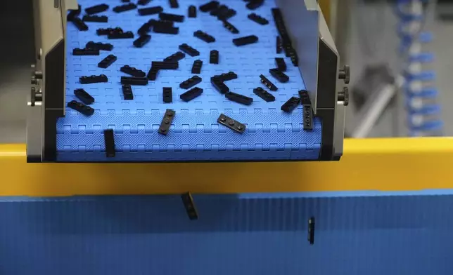 Lego bricks are moved on conveyor belt at Lego factory in Binh Duong, Vietnam Wednesday, April 2, 2025. (AP Photo/Hau Dinh)
