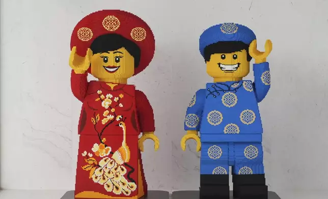 Lego characters in Vietnamese traditional costumes are displayed at Lego factory in Binh Duong, Vietnam Wednesday, April, 2, 2025. (AP Photo/Hau Dinh)
