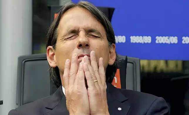 Inter Milan's head coach Simone Inzaghi reacts during the Serie A soccer match between Inter Milan and Roma at the San Siro Stadium, in Milan, Italy, Sunday, April 27, 2025. (Spada/LaPresse via AP)