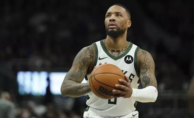 FILE - Milwaukee Bucks' Damian Lillard shoots a free throw during the second half of an NBA basketball game against the Orlando Magic, March 8, 2025, in Milwaukee. (AP Photo/Aaron Gash, File)