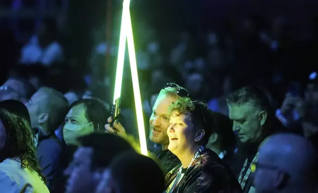Fans watch the opening act during the Star Wars Celebration in Chiba, near Tokyo, Friday, April 18, 2025. (AP Photo/Hiro Komae)