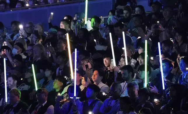 Fans watch opening act during the Star Wars Celebration in Chiba, near Tokyo, Friday, April 18, 2025. (AP Photo/Hiro Komae)