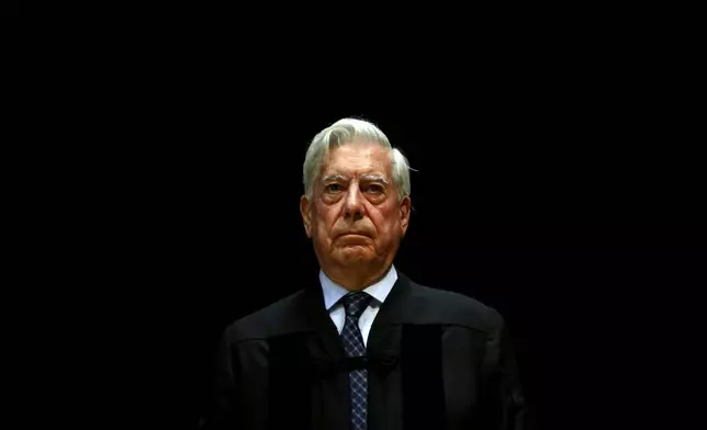 FILE - Peru's Nobel Literature Prize laureate Mario Vargas Llosa attends a ceremony where he was given an Honoris Causa degree by Lisbon Nova University, in Lisbon, Portugal, July 22, 2014. (AP Photo/Francisco Seco, File)