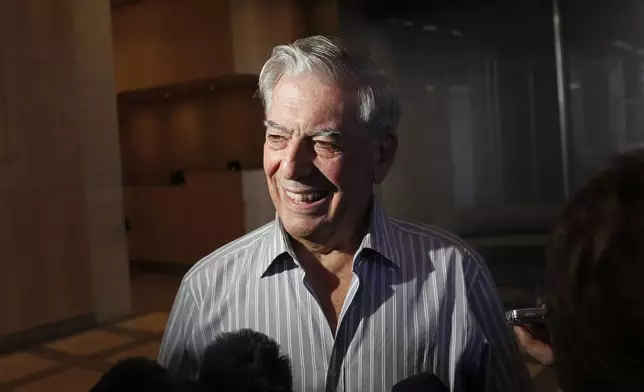 FILE - Writer Mario Vargas Llosa speaks to reporters in New York, Oct. 7, 2010. (AP Photo/Seth Wenig, File)