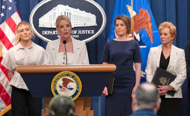 Attorney General Pam Bondi accompanied by from left Riley Gaines Rep. Laurel Libby R-Maine, and Education Secretary Linda McMahon speaks during a news conference to announce that the administration it is suing Maine’s education department for not complying with the government's push to ban transgender athletes in girls sports, at the Department of Justice headquarters in Washington, Wednesday, April 16, 2025. (AP Photo/Jose Luis Magana)