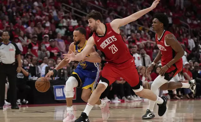 Houston Rockets center Alperen Sengun (28) defends against Golden State Warriors guard Stephen Curry (30) during the second half of Game 1 of an NBA basketball first-round playoff series in Houston, Sunday, April 20, 2025. (AP Photo/Ashley Landis)