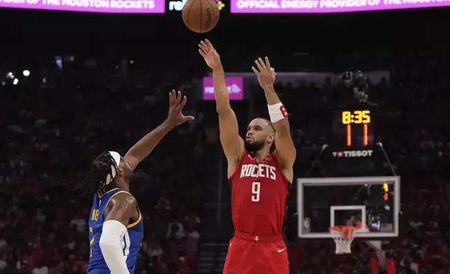 Houston Rockets forward Dillon Brooks (9) shoots against Golden State Warriors guard Buddy Hield (7) during the first half of Game 1 of an NBA basketball first-round playoff series in Houston, Sunday, April 20, 2025. (AP Photo/Ashley Landis)