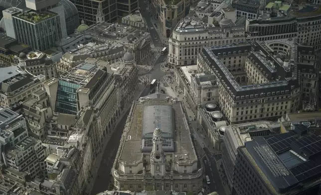 View of the Bank of England and the Royal Exchange from the Lookout viewing point, in London, Wednesday, April 9, 2025.(AP Photo/Alberto Pezzali)