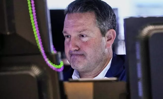 Trader Leon Montana works on the floor of the New York Stock Exchange, Wednesday, April 16, 2025. (AP Photo/Richard Drew)