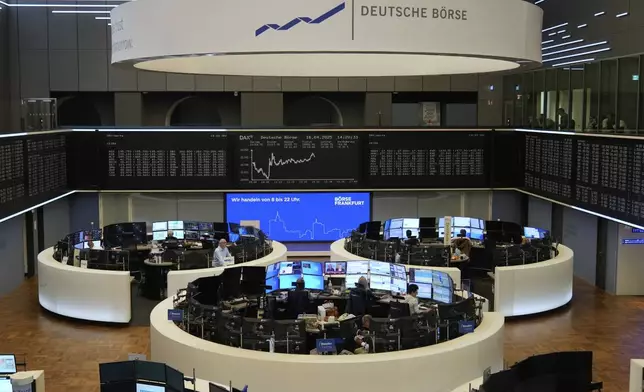 Broker watches their screens at the stock market in Frankfurt, Germany, Wednesday, April 16, 2025. (AP Photo/Matthias Schrader)