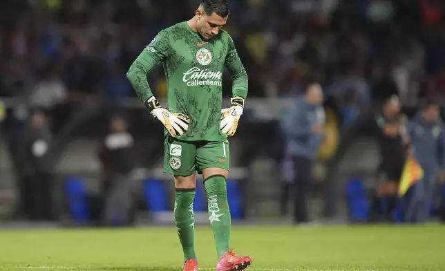 Goalkeeper Luis Malagon of Mexico's America reacts after Mexico's Cruz Azul scoring the second goal during a CONCACAF Champions Cup second leg quarterfinal soccer match in Mexico City, Tuesday, April 8, 2025. (AP Photo/Eduardo Verdugo)