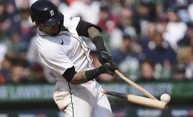 Detroit Tigers' Javier Báez breaks his bat on a ground out against the Kansas City Royals in the ninth inning during a baseball game, Sunday, April 20, 2025, in Detroit. (AP Photo/Paul Sancya)