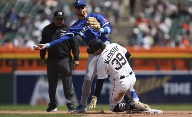 Kansas City Royals shortstop Bobby Witt Jr. throws to first base late on a force out on Detroit Tigers' Zach McKinstry (39) at second base in the fourth inning during a baseball game, Sunday, April 20, 2025, in Detroit. (AP Photo/Paul Sancya)