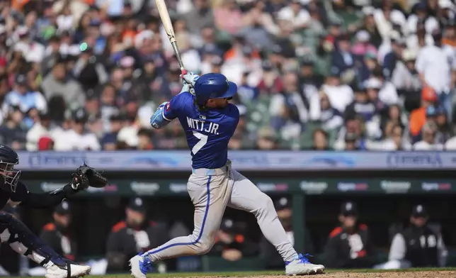 Kansas City Royals' Bobby Witt Jr. hits a sacrifice fly against the Detroit Tigers in the tenth inning during a baseball game, Sunday, April 20, 2025, in Detroit. (AP Photo/Paul Sancya)