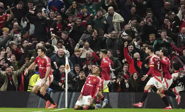 Manchester United's Harry Maguire, left, celebrates with team mates after his side's fifth goal during the Europa League quarter final second leg soccer match between Manchester United and Olympique Lyon in Manchester, Britain, Thursday, April 17, 2025. (AP Photo/Jon Super)