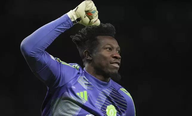 Manchester United's goalkeeper Andre Onana celebrates during the Europa League quarter final second leg soccer match between Manchester United and Olympique Lyon in Manchester, Britain, Thursday, April 17, 2025. (AP Photo/Jon Super)
