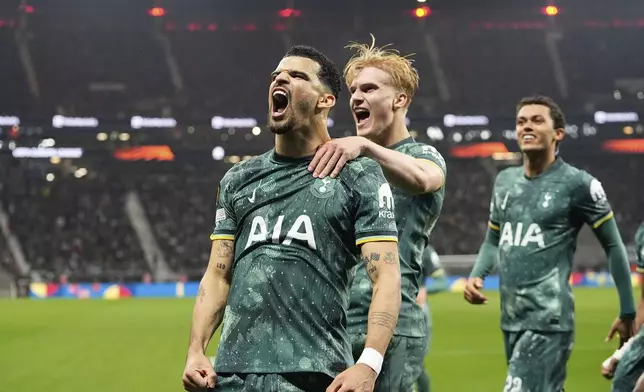 Tottenham's Dominic Solanke celebrates after scoring his side's opening goal during the Europa League quarterfinal second leg soccer match between Eintracht Frankfurt and Tottenham Hotspur, in Frankfurt, Germany, Thursday, April 17, 2025. (AP Photo/Martin Meissner)
