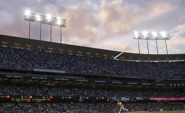 Los Angeles Dodgers starting pitcher Roki Sasaki delivers a pitch during the fifth inning of a baseball game against the Pittsburgh Pirates in Los Angeles, Saturday, April 26, 2025. (AP Photo/Kyusung Gong)