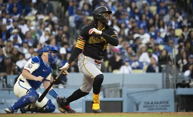 Pittsburgh Pirates' Oneil Cruz hits an RBI single during the fifth inning of a baseball game against the Los Angeles Dodgers in Los Angeles, Saturday, April 26, 2025. (AP Photo/Kyusung Gong)