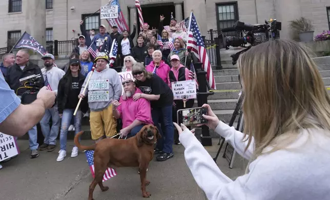 Supporters of Karen Read gather on the steps at Norfolk Superior Court prior to Read's trial, Tuesday, April 22, 2025, in Dedham, Mass. (AP Photo/Charles Krupa)