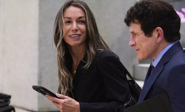 Karen Read returns to court following the lunch break with her defense attorney Robert Alessi at her trial at Norfolk Superior Court, Tuesday, April 22, 2025, in Dedham, Mass. (AP Photo/Charles Krupa)